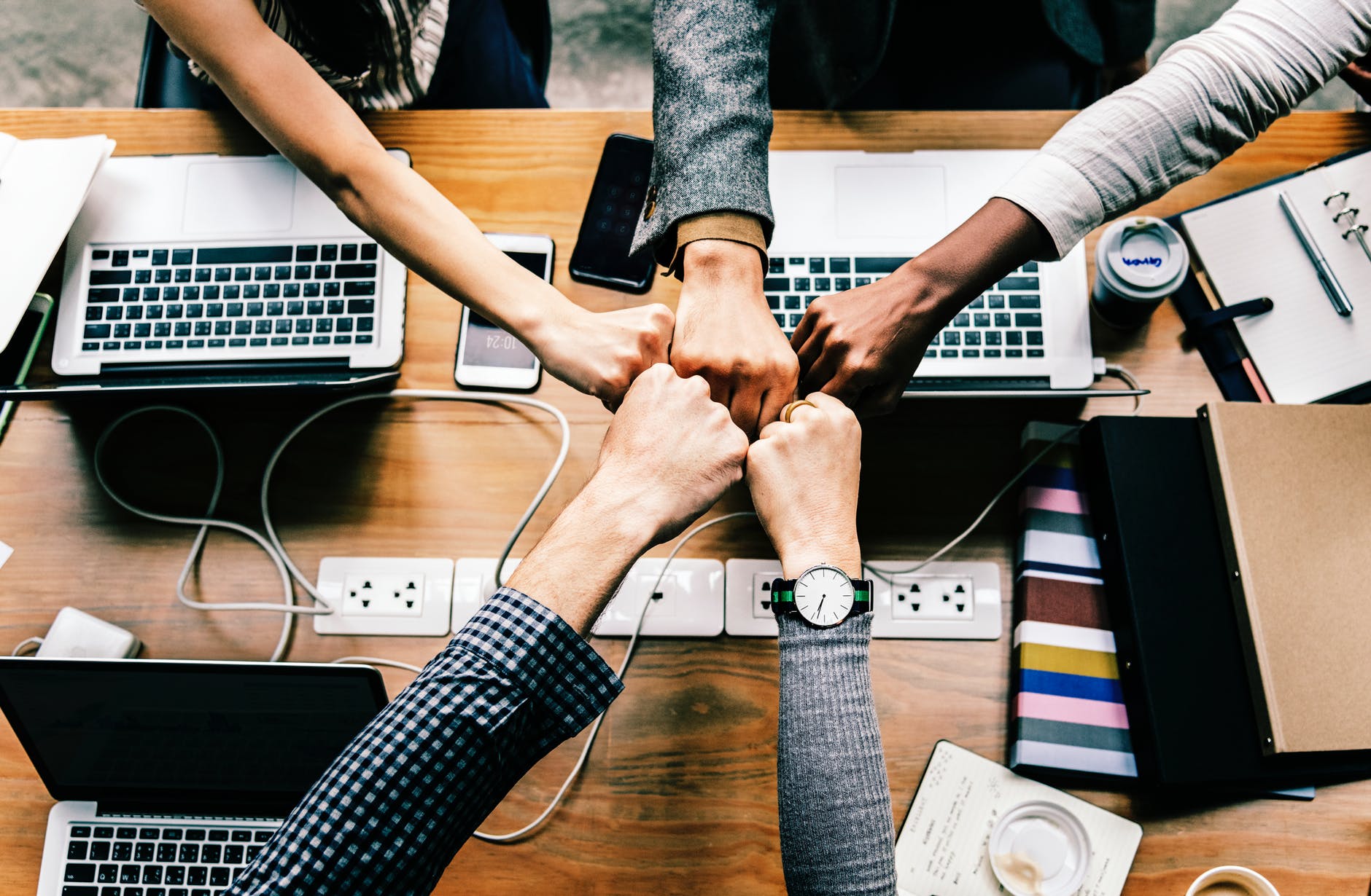 group hand fist bump